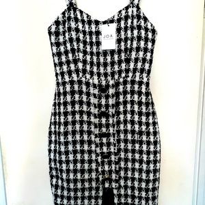 Small black and white dress. Never Worn